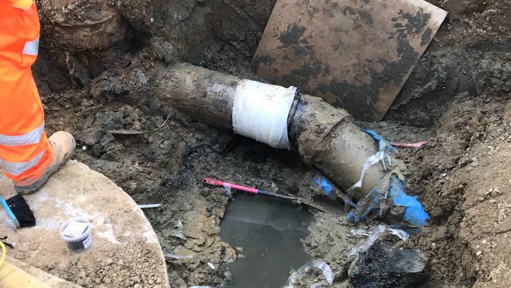 A live leak repair made using a SylWrap Universal Pipe Repair Kit is made to a steel contaminated water pipe at a wastewater treatment works in the UK