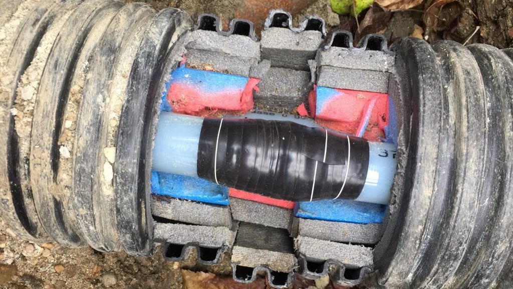 Wrap & Seal Pipe Burst Tape used to repair a live leak on an underground heating pipe